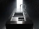 Brushed stainless steel kitchen sink with wooden cutting board