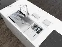 Brushed stainless steel kitchen sink with wooden cutting board